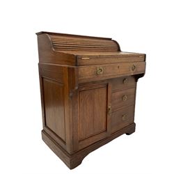Christopher Pratt & Sons, early 20th century roll top writing desk, the frieze drawer operating the roll top, opening to reveal pigeon hole shelving and fall front with leather inlay, over three graduated drawers and one cupboard, opening to reveal one shelf, raised on castors W75cm, H96cm, D53cm