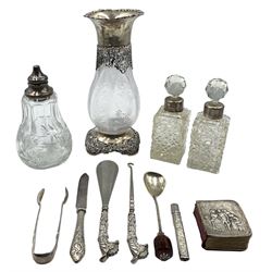 Edwardian engraved glass baluster vase with silver collar and foot with pierced and embossed decoration H19cm London 1905 Maker William Comyns, silver handled button hook and shoe horn, pair of glass scent bottles with silver collars, sugar caster with silver top and other items
