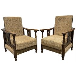 Pair of early 20th century armchairs, the oak frame with beige cushions 