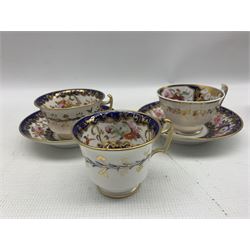 John Rose Coalport trio decorated with floral panel within a blue an gilt surround, 19th century Derby coffee can and saucer with Stephenson & Hancock mark and eight other cabinet cups and saucers including Coalport, Daniel etc