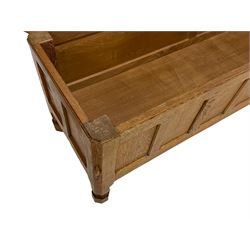 Mouseman - adzed oak blanket chest, hinged top over eight panelled front, carved Mouse signature, on octagonal feet, by the workshop of Robert Thompson, Kilburn 