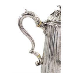 Victorian silver coffee pot of fluted tapering design, the domed cover with a floral lift, leaf capped handle and spout and on a spreading foot, engraved with a crest H24cm London 1844 Maker Richard Sibley retailed by Makepeace, London 28.7oz Provenance: 2nd Baron Feversham