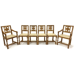 Set six (4+2) Eagleman Yorkshire oak dining chairs, with Yorkshire rose carved backs, leather upholstered and studded seat pads, raised on octagonal turned and block supports united by 'H' stretcher, W53cm - Mouseman interest
