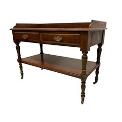 Late 19th century walnut washstand or buffet, the raised back on rectangular top with moulded edge, fitted with two drawers over under-tier, raised on ring turned supports terminating in ceramic castors