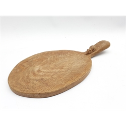 Thompson of Kilburn Mouseman oak cheese board of oval design, the raised handle with carved mouse signature L37cm