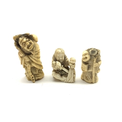 Three 19th century Japanese ivory netsukes depicting three figures in various poses (3)