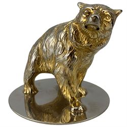 Asprey gilt metal paperweight in the form of a bear on a white metal base inscribed 'Asprey' H9cm