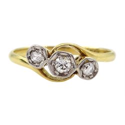 Early 20th century three stone old cut diamond crossover ring, stamped 18ct Plat