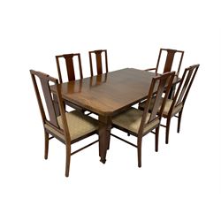 Edwardian mahogany telescopic extending dining table with additional leaf, raised on square tapering inlaid supports on brass castors (123cm x 104cm x 72cm); and set six (4+2) Edwardian mahogany dining chairs with boxwood stringing, seats upholstered in cream patterned fabric (50cm x 48cm x 104cm)