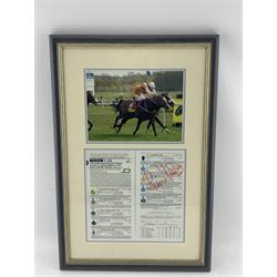 20th century Omani presentation jambiya in white metal scabbard the frame inscribed 'The Dubai Duty Free Stakes, Newbury 2002' 64cm x 61cm.  The jambiya was presented to the owner of Zindabad, the winning horse and is accompanied by the race card signed by the jockey, Kevin Darley, framed (2)
