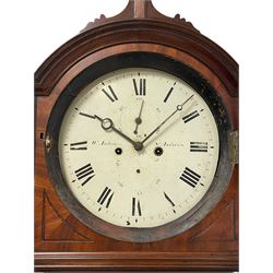 William Anderson of St Andrews – 8-day mahogany drumhead longcase clock c1840, break arch hood surmounted with scroll shaped pediment and a brass ball and eagle finial, wooden dial surround with canted reeded corners and recessed panels, trunk with recessed reeded pilasters to the corners, inlaid with yew and satinwood inlay, shoulder topped trunk door with inlay to the edge, conforming plinth with an applied decorative skirting, circular 12” painted dial with Roman numerals and minute track, subsidiary date and seconds dials, steel moon hands and brass cast bezel with a convex glass, anchor escapement with a rack striking movement, striking the hours on a bell. With weights, pendulum and key.
William Anderson is recorded as working in South Street, St Andrews (Scotland) 1832-67. Succeeded by his son George 1860-92.
