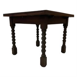 Early 20th century oak draw-leaf extending dining table, raised on spiral turned supports with square feet