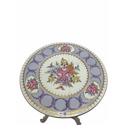 German porcelain occasional table, circular top raised on three splayed supports, all decorated with gilt stencilling and floral bouquets D47cm, H69cm