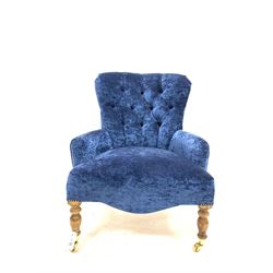 Quality Victorian style upholstered button back armchair, raised on turned beech front supports with brass cup castors W66cm