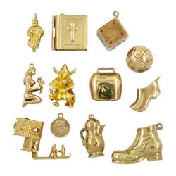 Twelve 9ct gold pendant/charms including Viking troll, dice, football, boot, church wedding, and cowbell