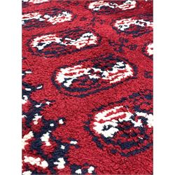 Thick pile hand woven runner, repeating blue and white gul motif on red field, enclosed by border 365cm x 93cm