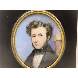 Mid 19th century half length oval portrait miniature, watercolour on ivory of a young gentleman wearing a black coat and stock 8cm x 7cm in ebonised frame.  The reverse inscribed 'Cheltenham 28 May 1841, painted by Mrs Wright, born without hands'. This item has been registered for sale under Section 10 of the APHA Ivory Act