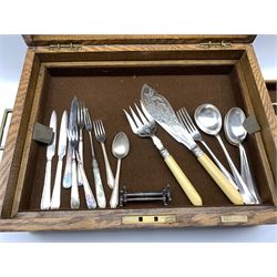Oak cutlery box by Mappin and Webb with two lift out trays containing a quantity of assorted cutlery, bone handled knives, pair of engraved plated fish servers etc W46cm
