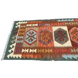 Anatolian Turkish Kilim runner rug in forest tones, the field with six hexagonal lozenges, surrounded by a double-band border with repeating geometric patterns