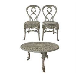 Pair of aluminium garden chairs with all over floral design, together with a circular aluminium table  
