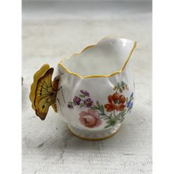 Aynsley Butterfly handle jug printed with a floral pattern rd. no. 785788 together with an Aynsley cup and saucer 