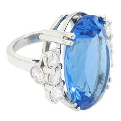 Platinum oval blue topaz ring, with four round brilliant cut diamonds set either side, hallmarked, topaz approx 30.00 carat, total diamond weight approx 2.50 carat