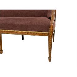 Regency period walnut framed three seat settee, the cresting rail painted with ebonised guilloche decoration, upholstered in textured mauve fabric with sprung seat, raised on square tapering supports with spade feet