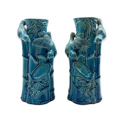 Pair of pottery vases in the manner of Burmantofts, each modelled as birds perched on bamboo, unmarked, H26cm 