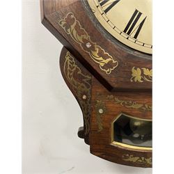 Single Fusee 8-day wall clock in a Mahogany case with a 17” Hexagonal wooden dial surround retailed by the 19th century Schwerer family of York clockmakers, dial inscribed “Schwerer, 38 Stonegate, York” drop dial case profusely inlaid with brass decoration and curved pendulum viewing lenticle, 12” painted dial with Roman numerals, minute track and finely pierced moon hands.
The Schwerer Family of German clockmakers consisted of three brothers, Philip, Peter, and Mathew who came to York in 1834 and traded from both Stonegate and Petergate at various dates during the early to mid-19th century.


