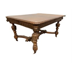 Victorian oak dining table, the wind out top over carved frieze, raised on carved balusters united by a stretcher terminating in castors with two leaves, together with six dining chairs of similar design 
