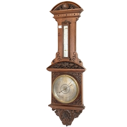  Victorian carved oak aneroid barometer and thermometer, with silvered registers, H101cm  