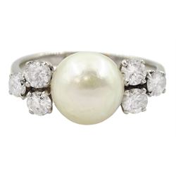 18ct white gold pearl ring, set with three round brilliant cut diamonds either side, approximate total diamond weight 0.60 carat 
