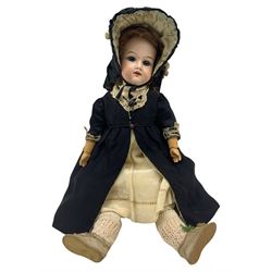 Armand Marseille 390 doll bisque headed doll with sleeping blue eyes, open mouth and teeth, jointed composition body wearing period black dress, petticoat and bonnet H37cm
