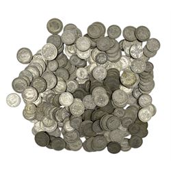 Approximately 2700 grams of Great British pre 1947 silver coins, including shillings, florins / two shillings and halfcrowns