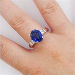 18ct white gold single stone oval cut sapphire ring, with tapered baguette diamond shoulders, sapphire approx 4.15 carat