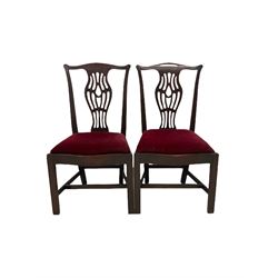 Set five (4+1) Georgian style mahogany dining chairs, shaped cresting rails over pierced baluster shaped splats with flower head motifs, moulded supports (W60cm), and a similar pair Georgian style dining chairs (7)