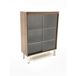 1970s hardwood glazed bookcase, with two sliding doors enclosing two adjustable shelves, raised on brushed stainless steel supports, W76cm, H101cm, D39cm