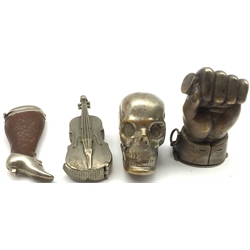 Four novelty vesta cases comprising plated skull, plated cello, leather and plated case in the form of a lady's leg marked Deponirt and another in the form of a gauntlet