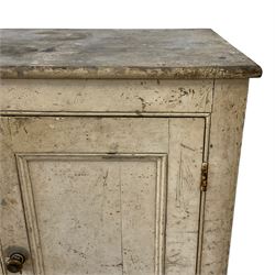 19th century rustic painted pine cupboard, fitted with two panelled cupboard doors enclosing two shelves, on plinth base