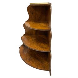 Mid-to late19th century walnut corner three tier etagere, with swept and shaped uprights 