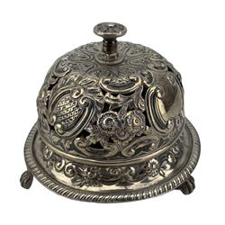 Late Victorian silver table bell of domed circular form with pierced and repousse decoration on paw feet D9cm Birmingham 1891 Maker Samuel Walton Smith.  Provenance: From the Estate of the late Dowager St Oswald 