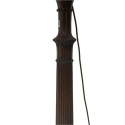 20th century standard lamp, with one turned and reeded column leading into three splayed supports, terminating in brass hairy paw castors 