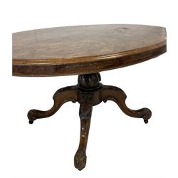 Victorian burr walnut tilt top loo table, the oval top raised on turned column, leading into four cabriole supports 