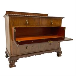 Mid-20th century mahogany linen chest, raised back over rectangular top with gardroon carved edge, two short drawer over two long drawers, the upper long drawer with fall front, canted upright corners, on ogee bracket feet carved with gadroons and c-scrolls