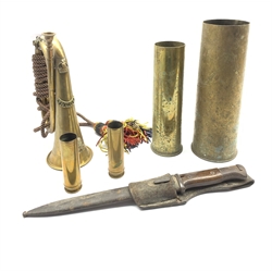 World War I German bayonet and scabbard, 25cm blade inscribed 'Gottlieb Hammersfahr, Solingen Foche, brass bugle with Lincolnshire Regt. badge inscribed 'Cutler 1921' and four brass shell cases