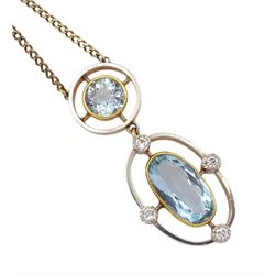 Early 20th century 15ct gold and platinum, milgrain set aquamarine and diamond pendant, on later 9ct gold trace link chain necklace