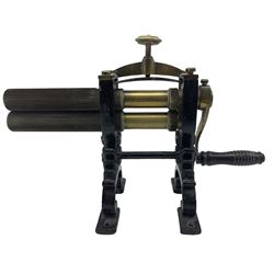 Victorian cuff and collar table top mangle with ribbed brass rollers in a cast iron frame with turned wood handle L32cm overall
