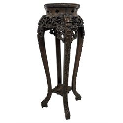 Late 19th to early 20th century century tall Chinese carved hardwood jardinière or urn stand, rose marble top in bead carved surround, pierced and carved flower head and foliage frieze rails, on dragon mask carved cabriole supports with trailing floral decoration, joined by carved and pierced under-tier 