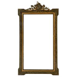 19th century giltwood and gesso wall mirror, the rectangular frame with c-scroll and torch pediment, moulded scrolling flower head and foliage decoration, foliage moulded corner brackets