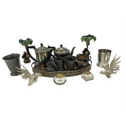 Pair of metal palm tree and monkey candlesticks, pewter measures, plated tea set etc